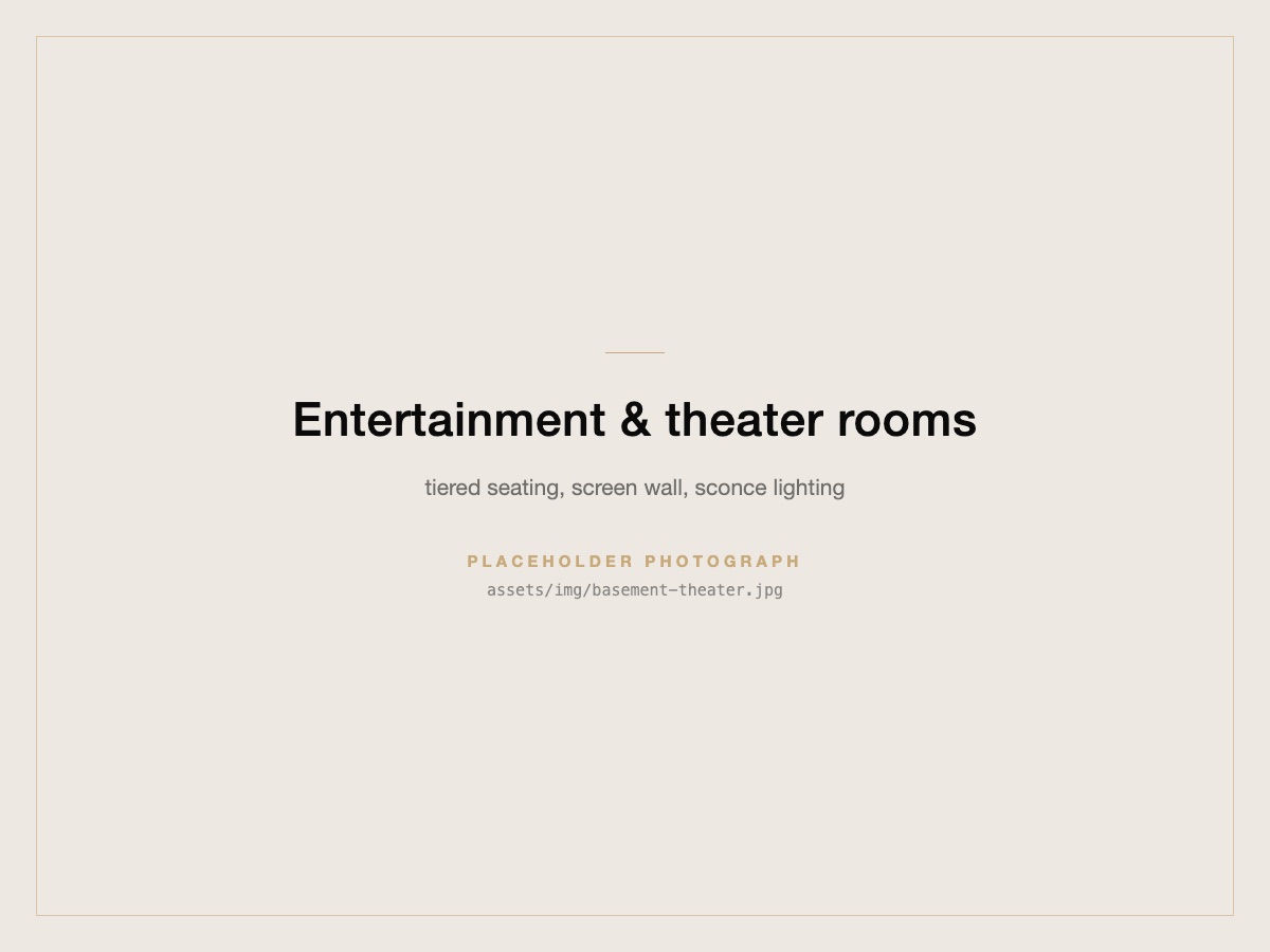 A finished basement theater room with tiered seating facing a screen wall.
